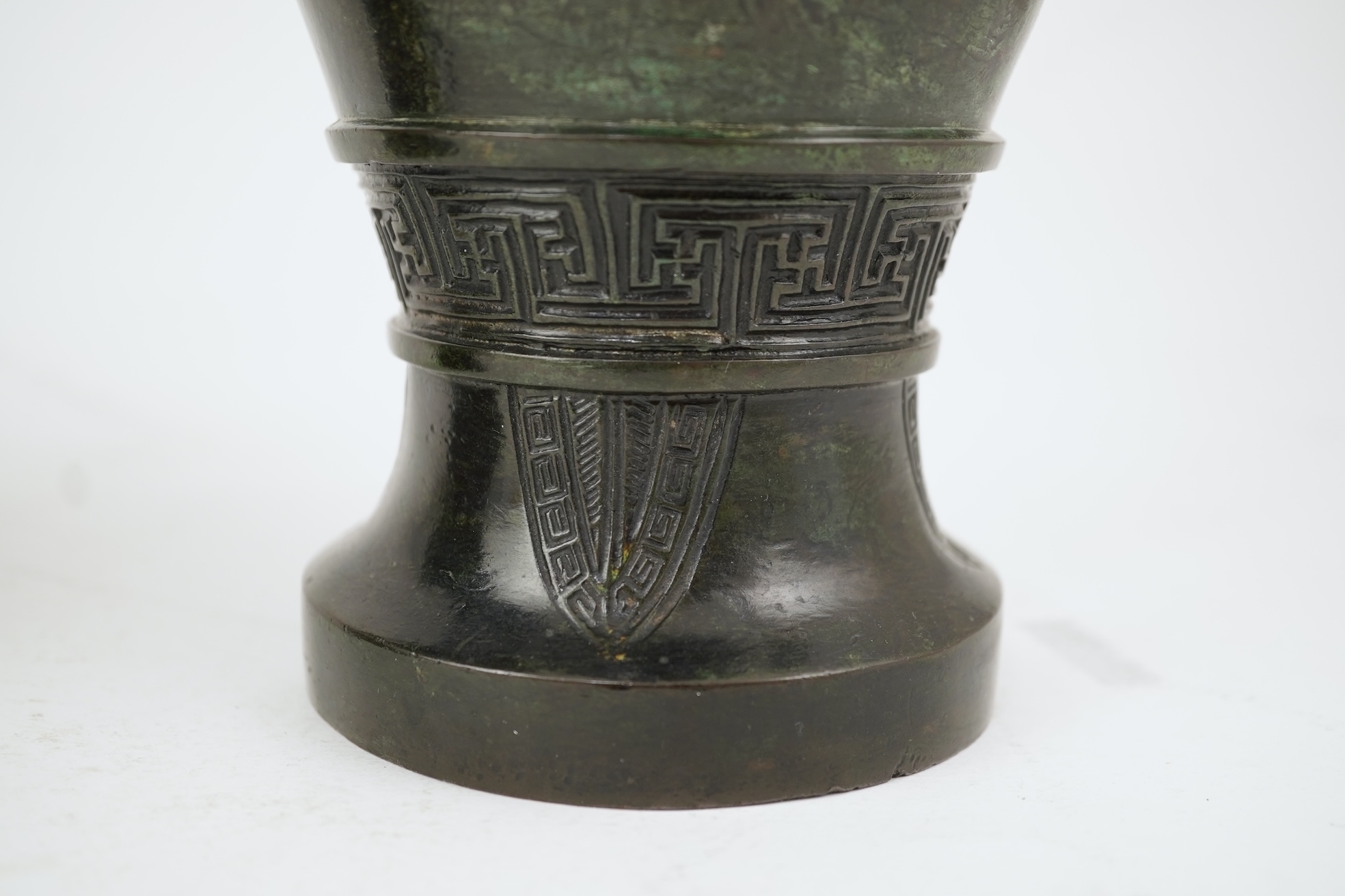 A pair of Chinese bronze gu-shaped vases, Qing dynasty
